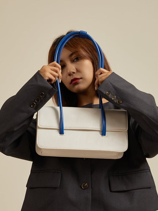 High Sense Of Klein Blue Contrast Color Handbag for Women, front view product photo showing blue structured handbag with magnetic closure